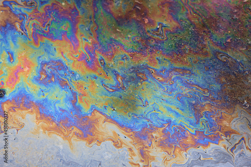 spilled gasoline rainbow background, industrial hazard spill pollution, abstract texture multicolored