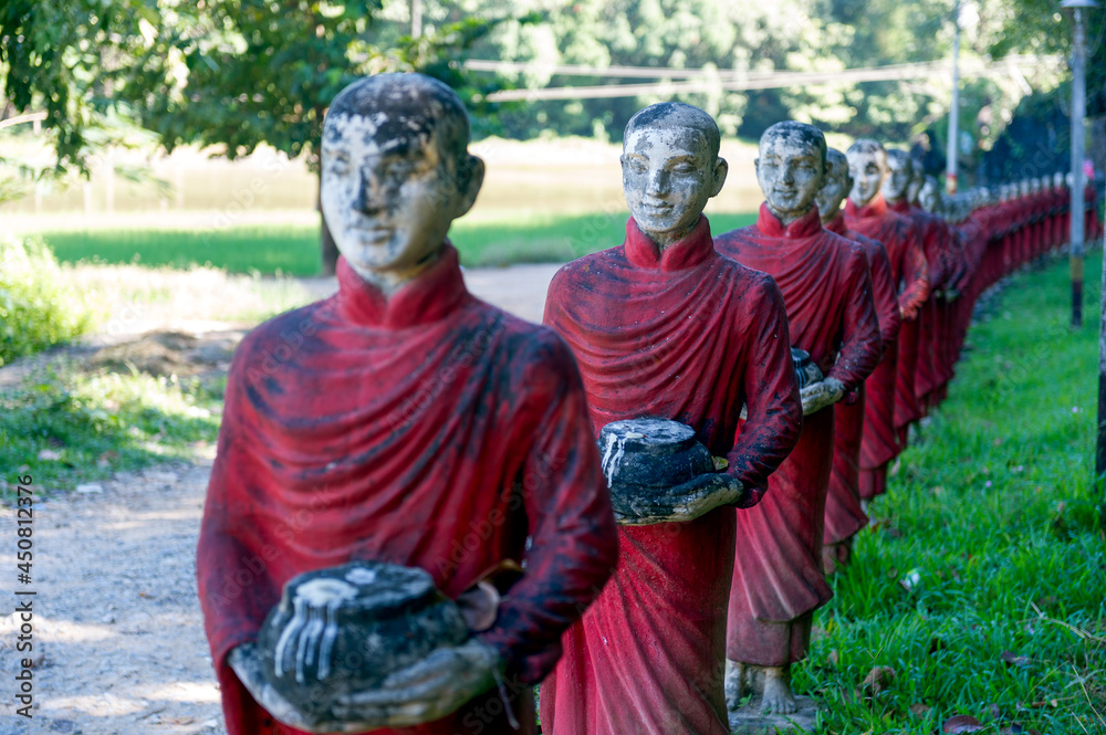 Myanmar (formerly Burma). Kayin State (Karen State). Hpa-An. Row of a hundreds of monks Arahant statues in a Kaw Ka Taung Cave