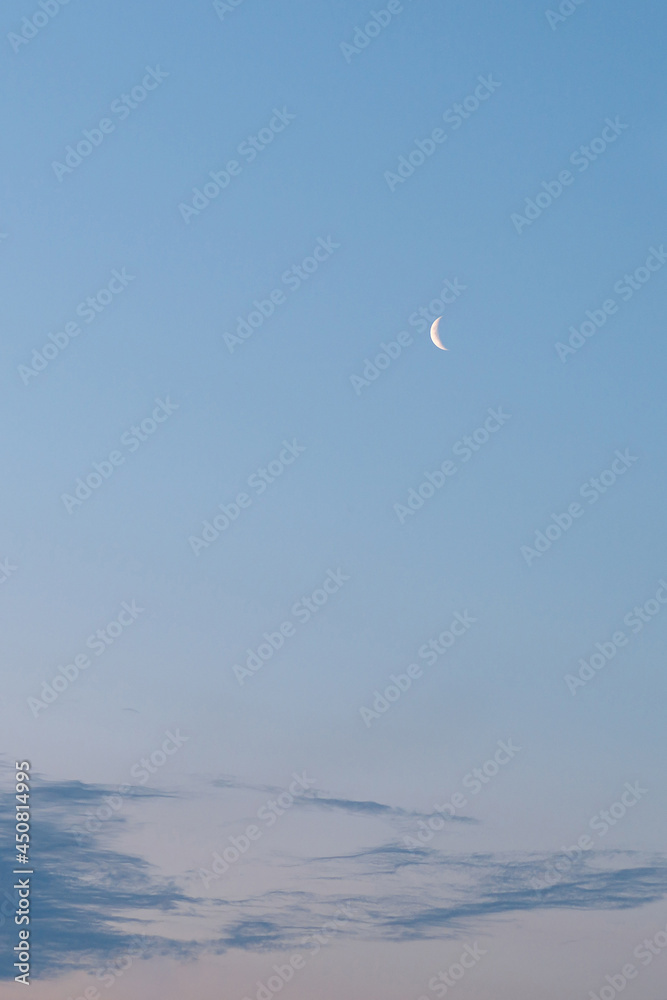 evening clear sky with a moon and clouds below evening clear sky with a moon and clouds below