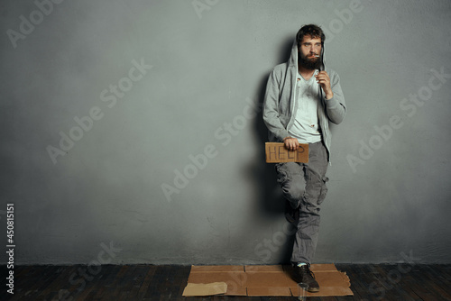 Fotografija homeless bearded man asking for money on the street lifestyle problems