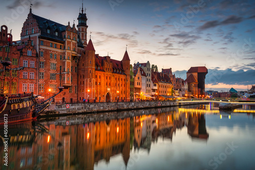 Gdansk with a historic crane at the Motława River at sunset, Poland.