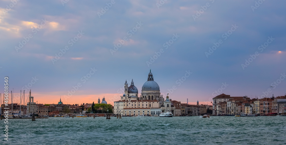 Sunset sky scene at  Grand Canal and Basilica Santa Maria della Salute in Venice,Italy