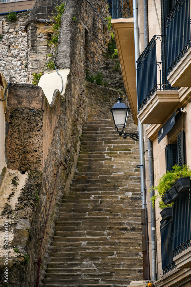 Street with steps in the historic center of San Sebastián (Donostia), Guipuzcoa, Country Basque, Spain.