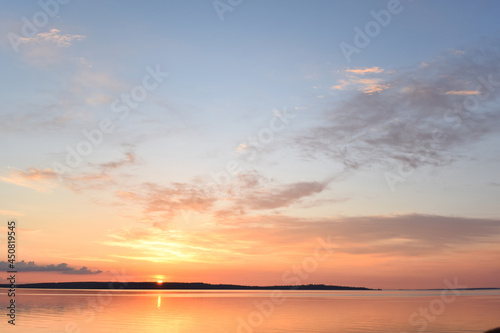 Сlouds lit by the sun setting over the horizon
