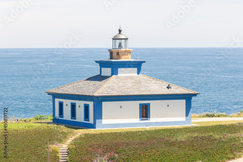 Nice view of the lighthouse of the town of Ribadeo during the day, as one of the most touristic natural environments of Gallicia, close up. photo