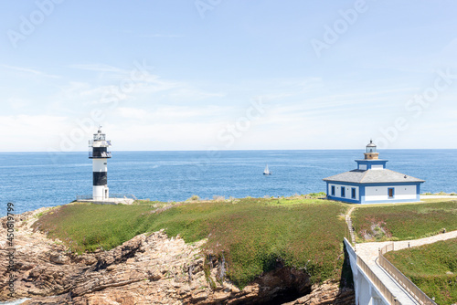 Nice view of the lighthouse of the town of Ribadeo during the day, as one of the most touristic natural environments of Gallicia. photo