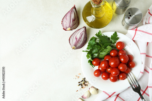 Concept of pickled vegetables with tomatoes on white textured table