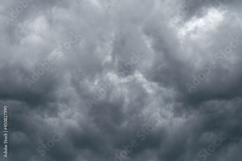 Dramatic sky background with dark storm clouds in dark sky. Black clouds before rainy.