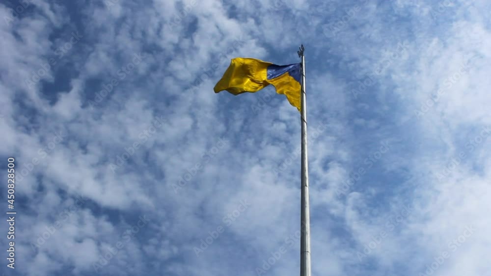 Ukrainian flag. Flag Day of Ukraine. Independence Day of Ukraine. National flag of the state of Ukraine. Background of blue sky and white clouds. Flag of Ukraine. Ukrainian flag. Flag Day of Ukraine. Independence Day of Ukraine. National flag of the state of Ukraine. Background of blue sky and white clouds. Flag of Ukraine.