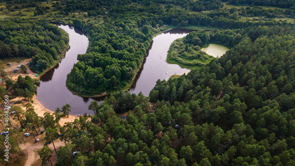 Aerial top view river, forest and beach. Gorgeous aerial panoramic view on the touristic part of the river Berezina in Belarus. Aerial top view river, forest and beach. Gorgeous aerial panoramic view on the touristic part of the river Berezina in Belarus.