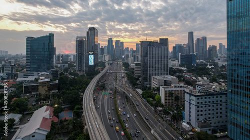 Aerial view of Panoramic photo of Jakarta overlooking Parklands, and the city skyline with a spectacular sunset. Jakarta, Indonesia, August 13, 2021 © syahrir