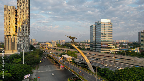 Aerial view of The Dirgantara Statue Monument or better known as the Pancoran Statue is one of the statue monuments located in Jakarta. Jakarta, Indonesia, August 13, 2021 photo