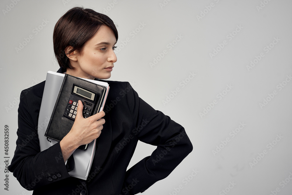 woman in black jacket documents Professional office manager woman in black jacket documents Professional office manager