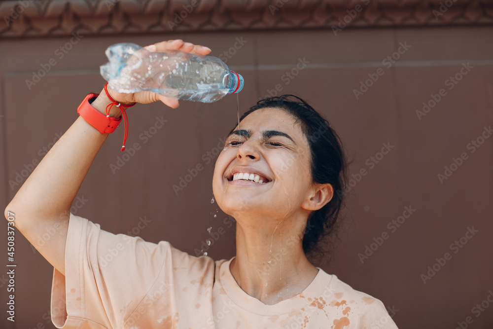 Stressed Woman Suffering Of Heatstroke And Refreshing Pouring With Cold