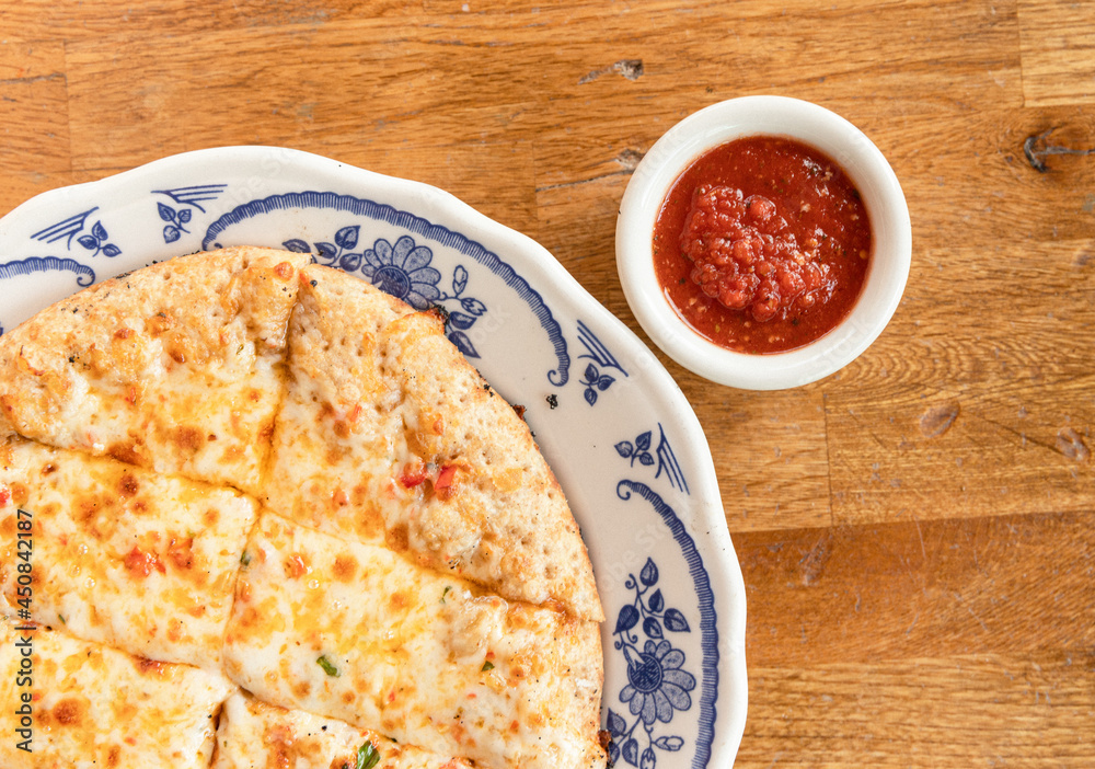 Cheesy Bread Appetizer and Marina on a Table Cheesy Bread Appetizer and Marina on a Table