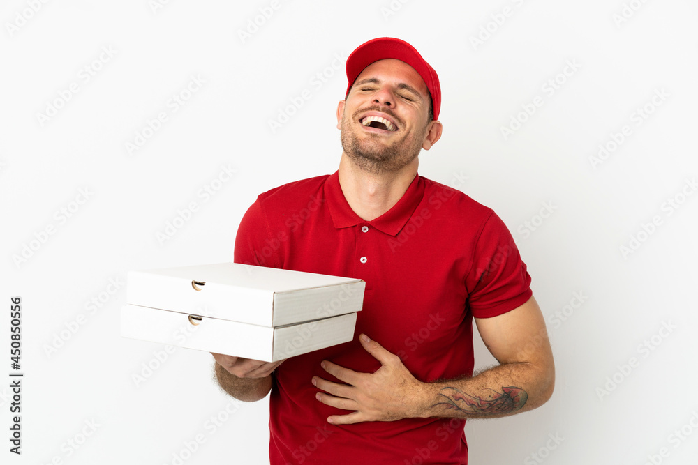 pizza delivery man with work uniform picking up pizza boxes over isolated white wall smiling a lot pizza delivery man with work uniform picking up pizza boxes over isolated white wall smiling a lot