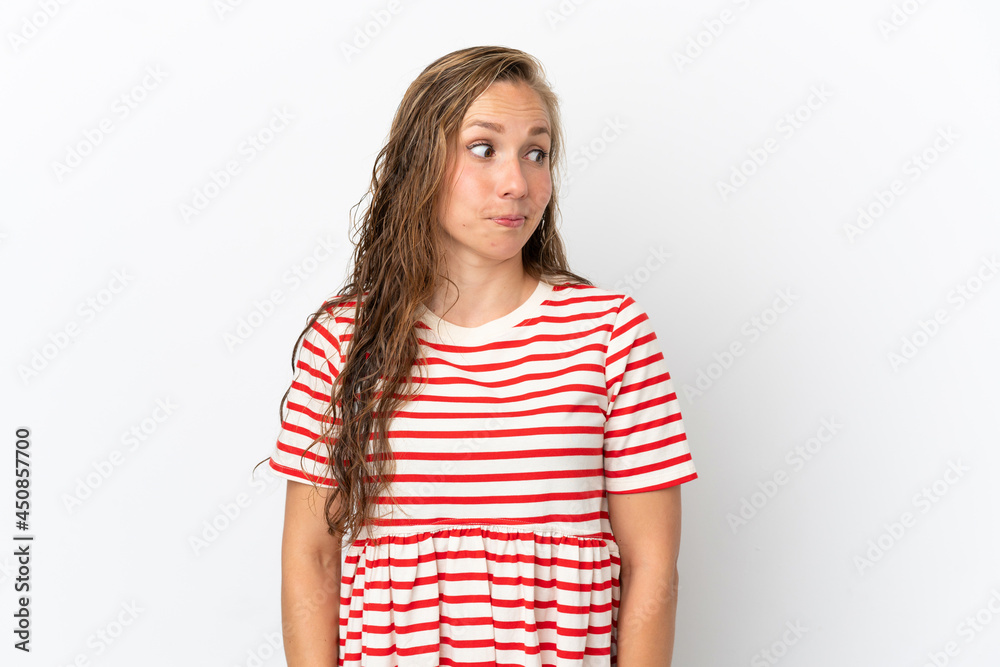 Young caucasian woman isolated on white background making doubts gesture looking side Young caucasian woman isolated on white background making doubts gesture looking side