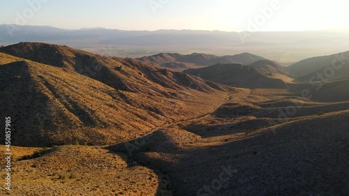 Dawn aerial shot of some remote desert mountains in California near the Nevada border