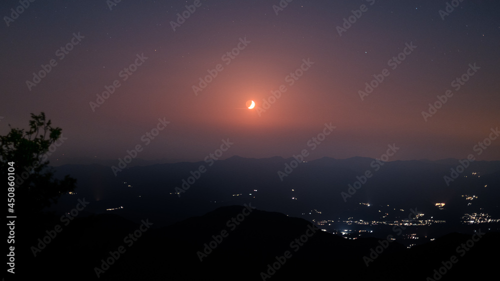 Sunset with red half moon