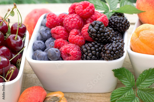Berries in a bowl, healthy vegetarian food, fresh organic fruit