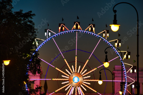 Closeup shot of Ferris wheel in Karolinenplatz in Germany with night lights photo
