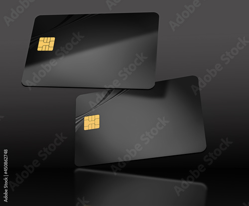 Two black generic credit cards or debit cards are seen floating in this 3-d illustration.