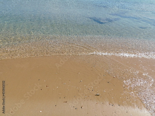 A beautiful sandy beach with clear waters, in Attica, Greece