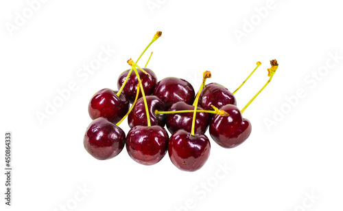 Crimson cherries piled on a white background. Clipping path.