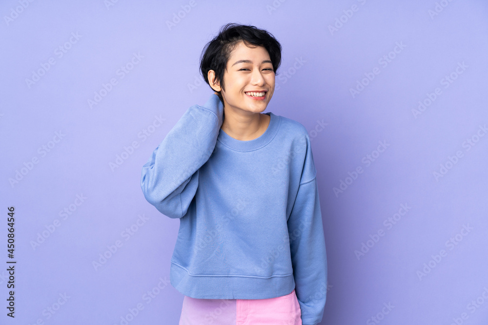 Young Vietnamese woman with short hair over isolated purple background laughing Young Vietnamese woman with short hair over isolated purple background laughing