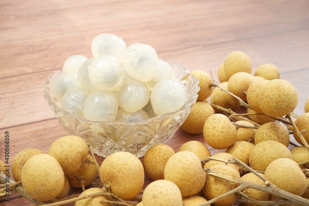Ripe longan on an old wooden background. Ripe longan on an old wooden background.