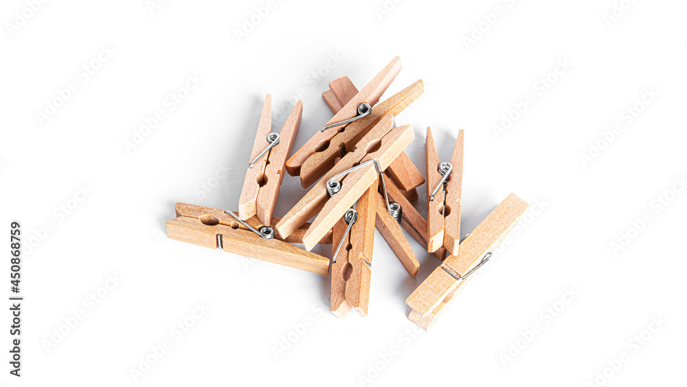 Wooden clothespins isolated on a white background.