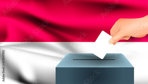 Monaco flag, male hand voting with Monaco flag concept idea background