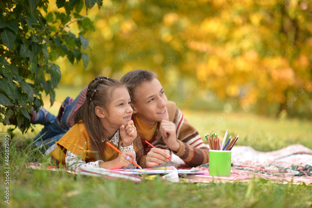 Little girl and boy drawing with pencils Stock Photo | Adobe Stock