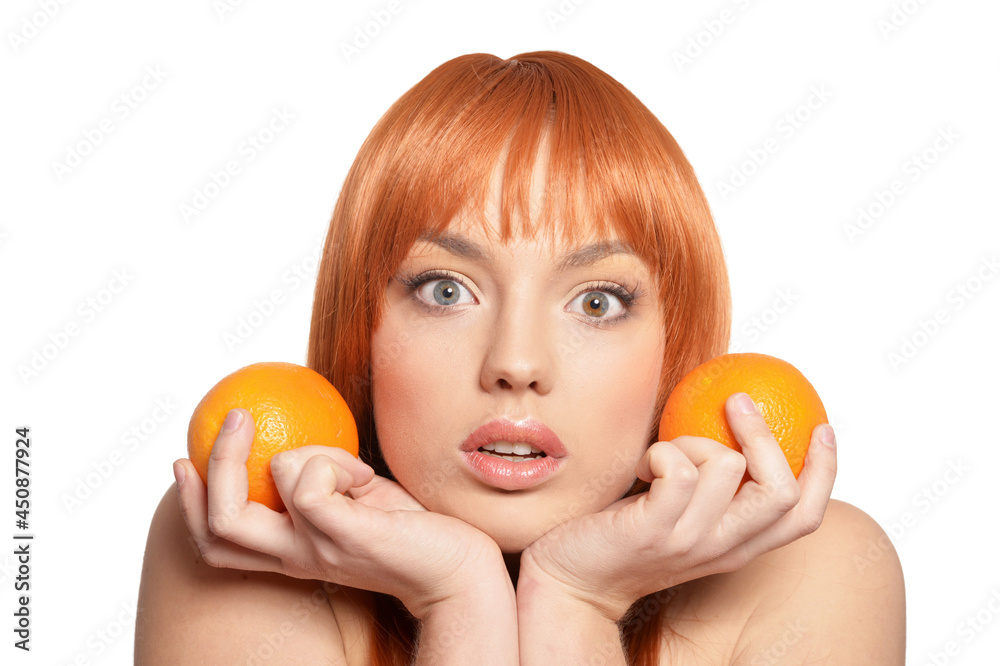 Portrait of young woman posing with oranges Portrait of young woman posing with oranges