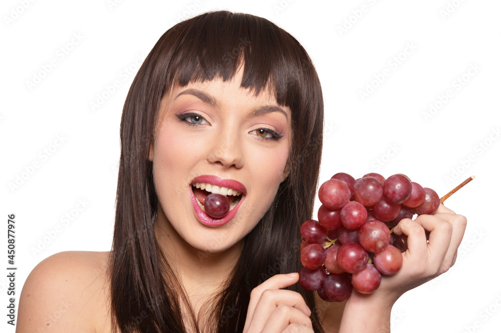 Portrait of young woman posing with grapes Portrait of young woman posing with grapes