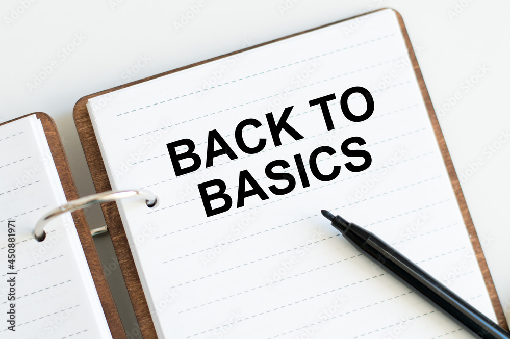 BACK TO BASICS text on an open bloncot next to a black marker BACK TO BASICS text on an open bloncot next to a black marker