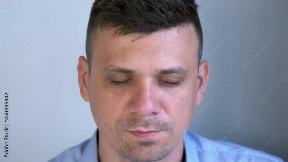 Closeup of man's eyebrows before painting procedure in beauty salon, face closeup. Man is sitting with closed eyes behind the camera. Closeup of man's eyebrows before painting procedure in beauty salon, face closeup. Man is sitting with closed eyes behind the camera.