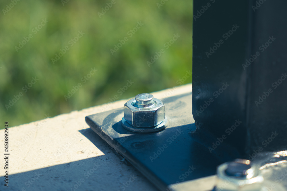 Concrete bolts fixed through the steel plate to the ground Concrete bolts fixed through the steel plate to the ground