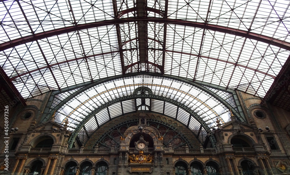 Antwerp Central Station, steel dome with stained glass windows, clock and beautiful architecture, Belgium.