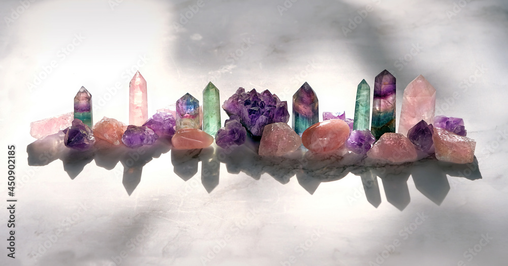 Different Minerals on marble background. Healing stones for Crystal Ritual, spiritual practice. modern magic. Esoteric life balance concept. Set of Fluorite, amethyst, rose quartz. - obrazy, fototapety, plakaty 