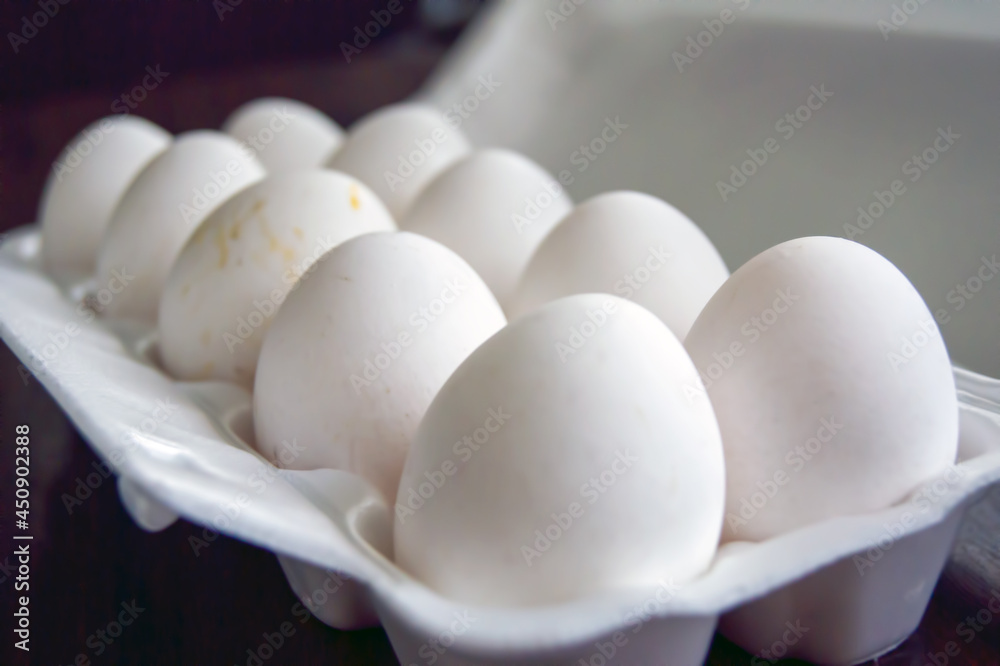 Open pack with raw white chicken eggs Open pack with raw white chicken eggs