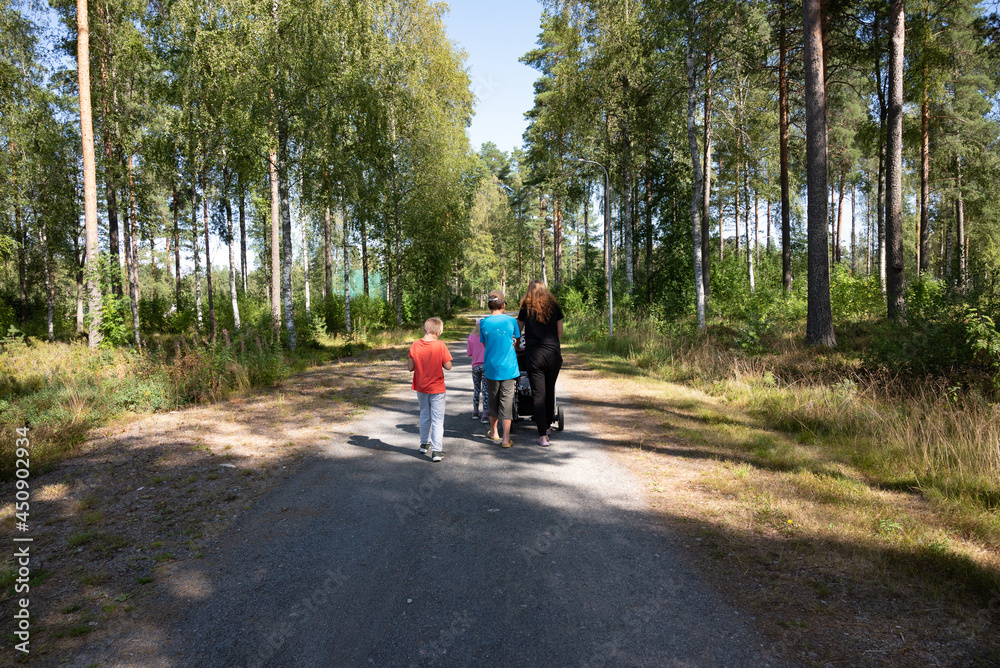 Fototapeta premium family walking in the country