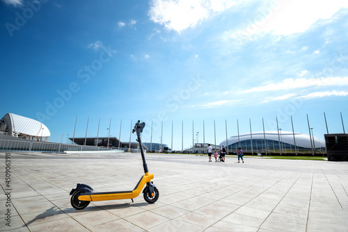 electric transport rental in the park for a walk. parking for electric scooters. the concept of ecological transport for people. mockup, Copyspace, Space for text photo