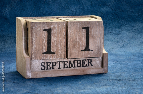 September 11 date in a rustic wood block calendar, reminder of terrorism attack photo