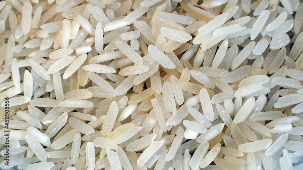 Rice on dark background as close up with copy space