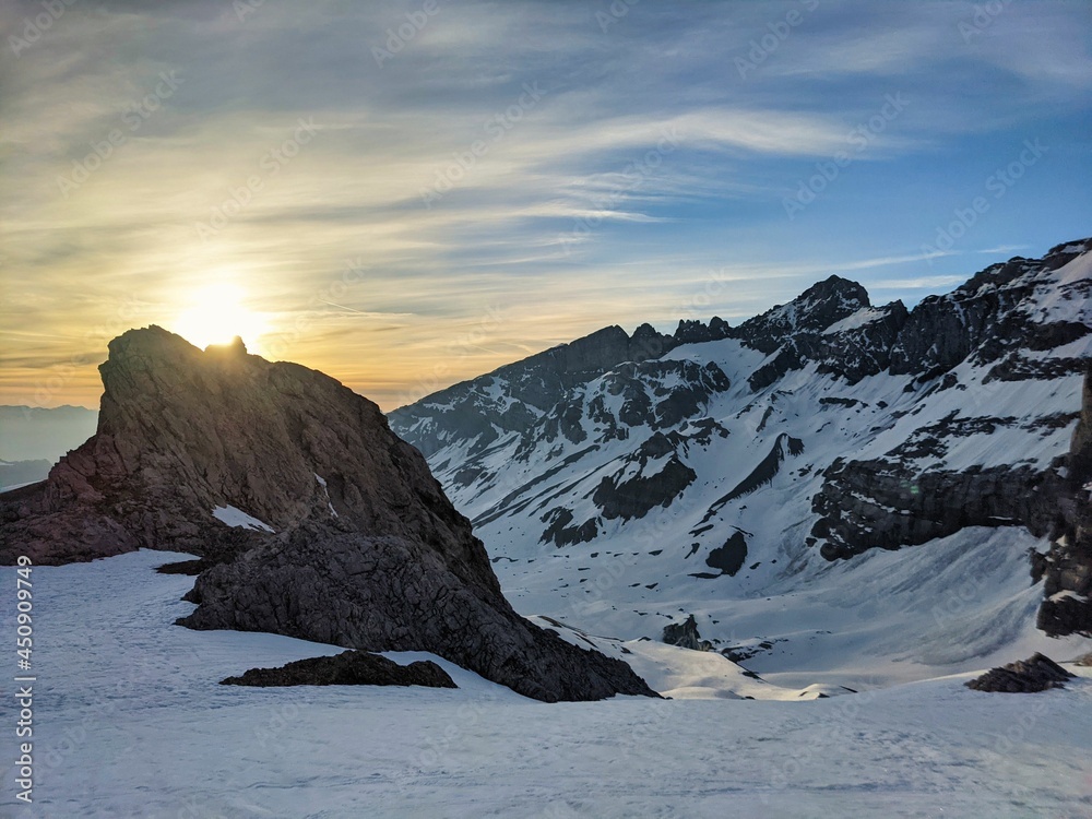 Ski tour at sunrise, Ski mountaineering ski touring on a mountain peak in the swiss alps. Clariden. Glarus uri. Winter - obrazy, fototapety, plakaty 