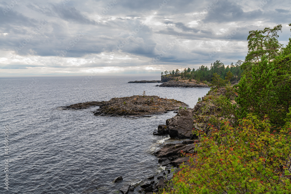 View of the rocky coast of Valaam island on a cloudy day