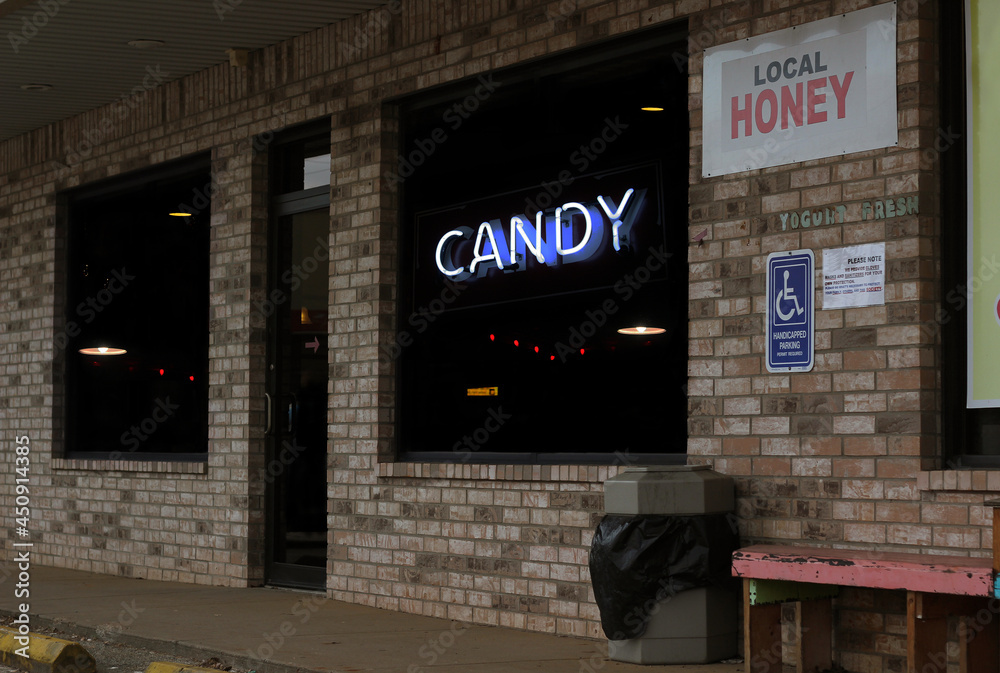 Local Honey Sign and Vintage Neon Candy Sign on Local Shop in Rural Texas