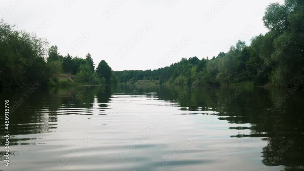 river in summer. reflection of trees in the water. panorama from the water. summer river landscape. 4k river in summer. reflection of trees in the water. panorama from the water. summer river landscape. 4k