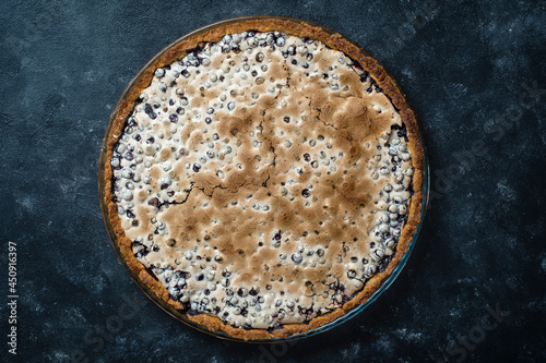 Homemade organic blueberry pie dessert ready to eat, close up. Blueberry meringue pie
